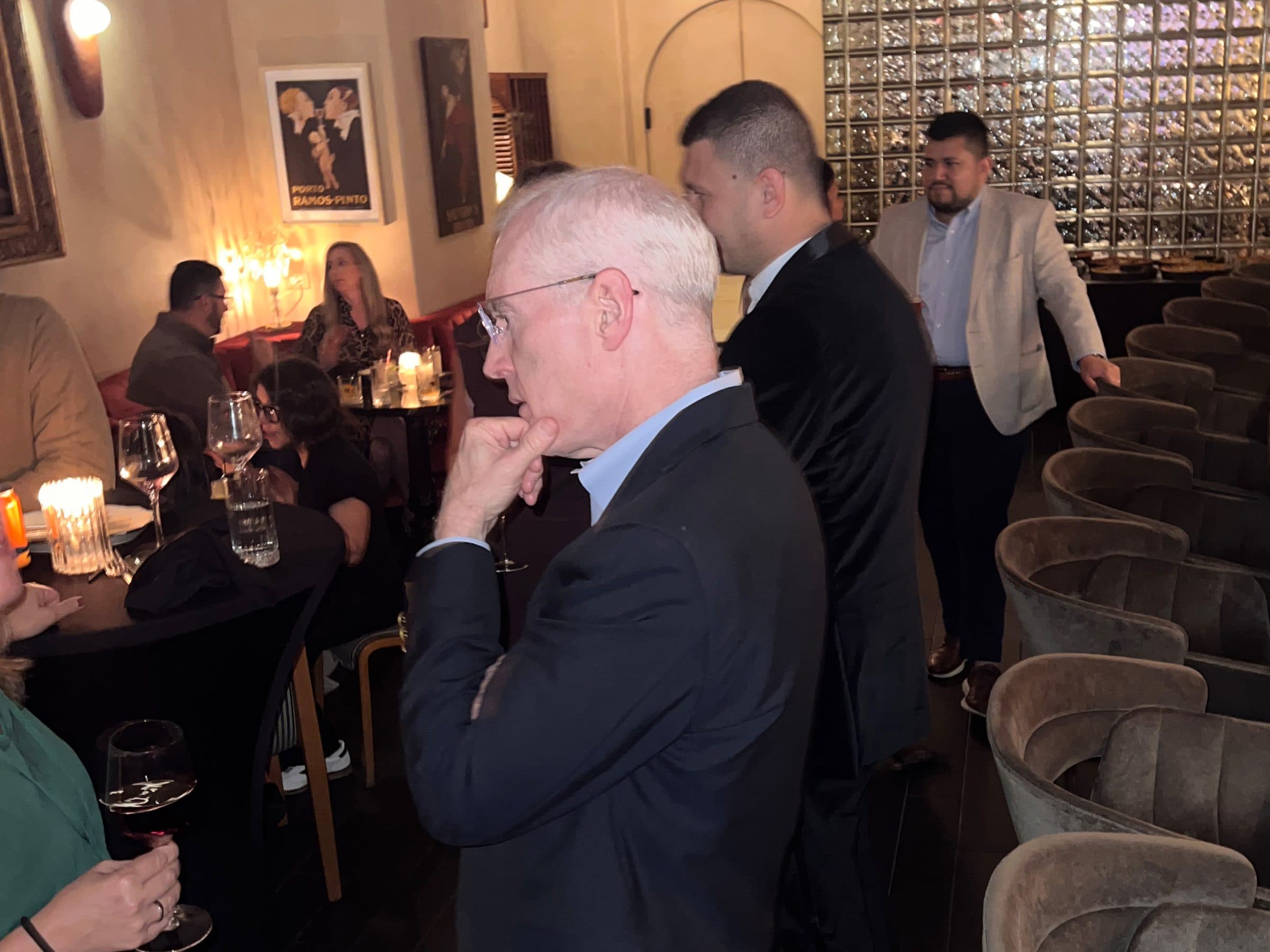 Guests listen during the board reception.