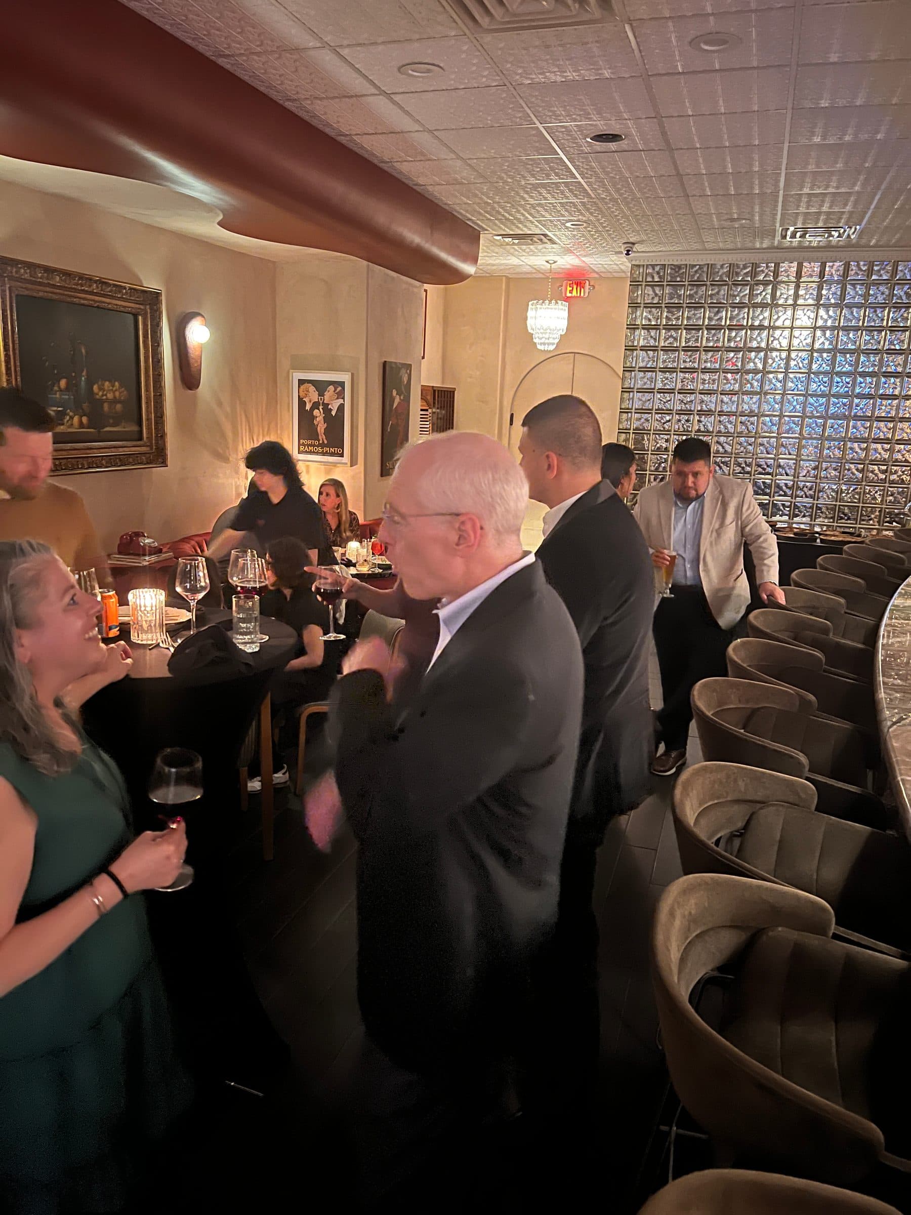 Guests mingle at the board reception.